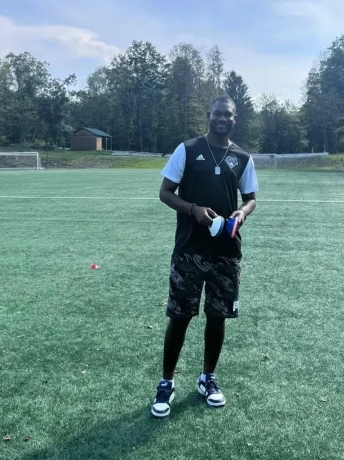 Coach Jean on the field